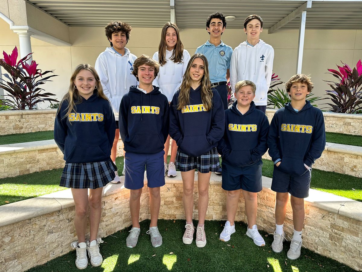 Students from Student Council standing outside in two rows smiling.