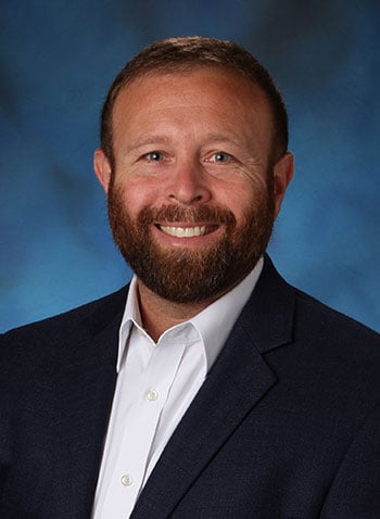 A formal headshot photo of faculty member Matt Schifeling.