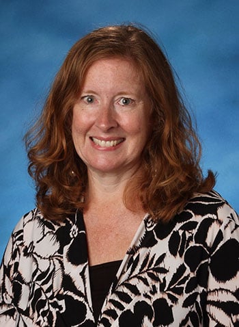A formal headshot photo of Kristen Orsini.