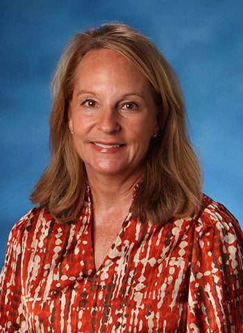 A formal headshot photo of faculty member Robin Page..