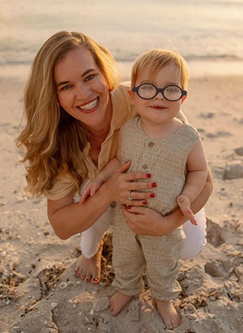 A picture of alumna Laura Alexander and her child.