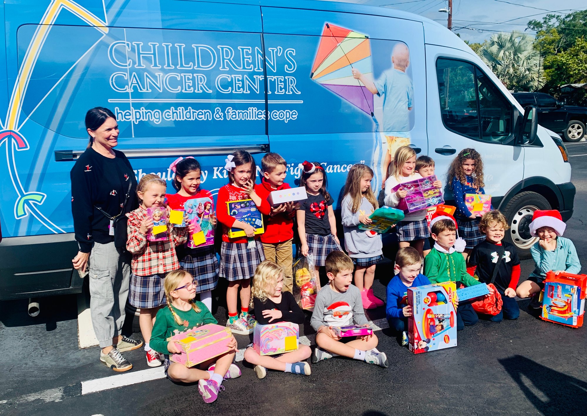 A kindergarten class donating gifts to the Children's Cancer Center